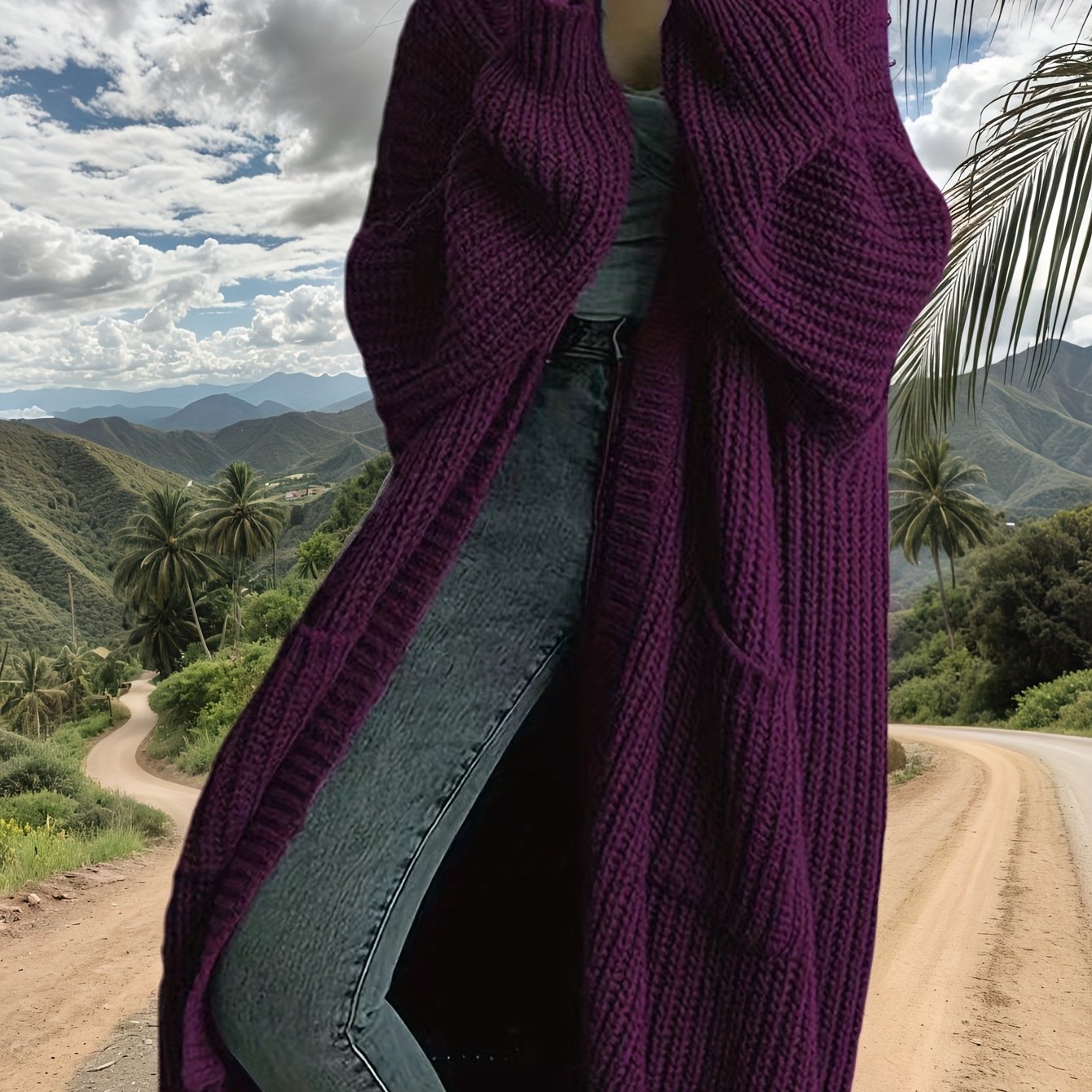 Person wearing a purple knitted cardigan with a scenic mountain landscape in the background