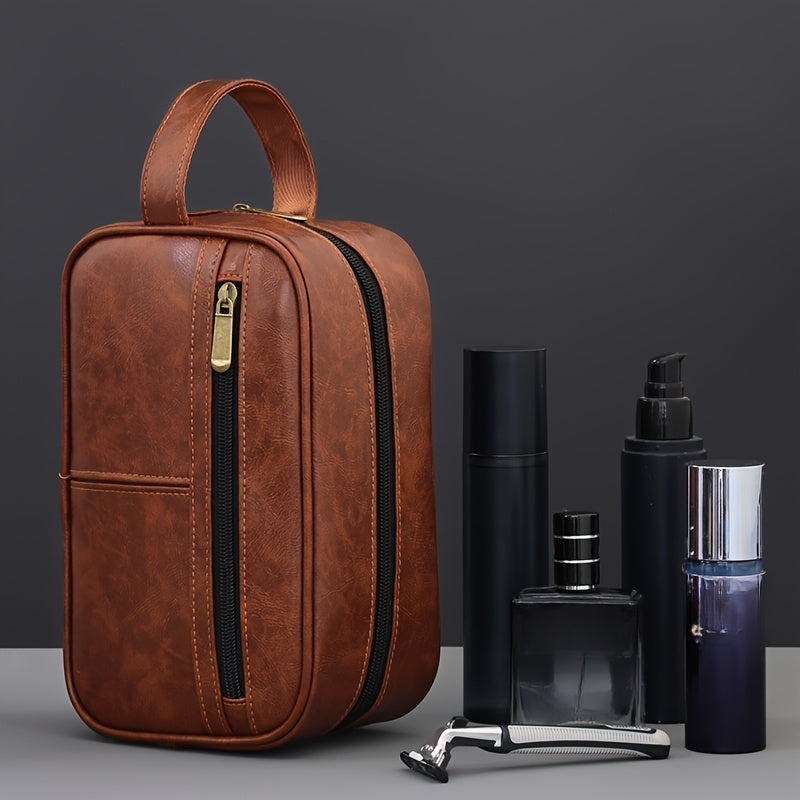 Brown leather toiletry bag with grooming products on a gray background