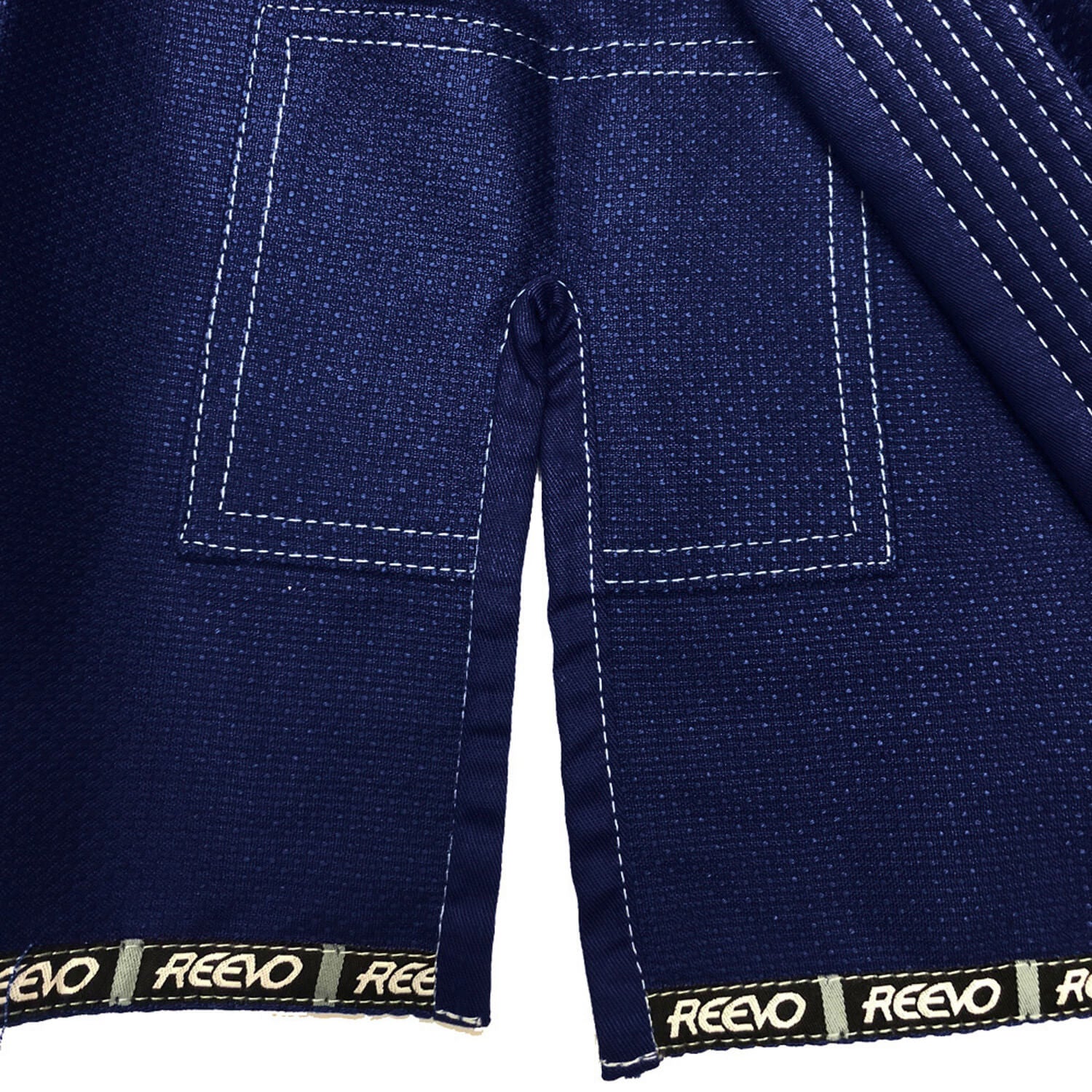 Navy blue BJJ gi with REEVO branding on a white background