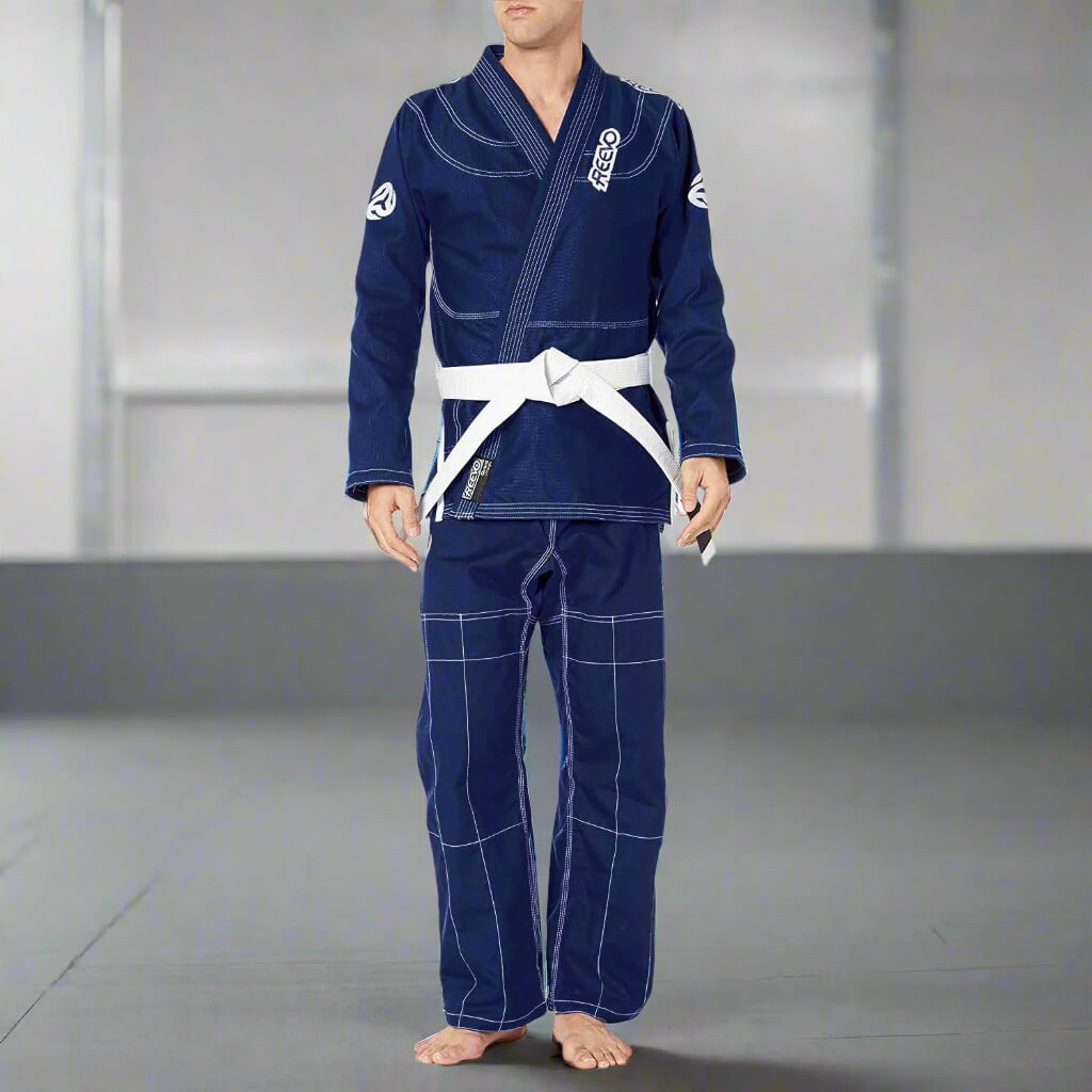 Person wearing a blue martial arts uniform with white belt on a neutral background