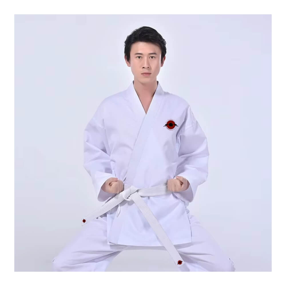 A man wearing a Kumite Karate Uniform sold by 100 Spartans