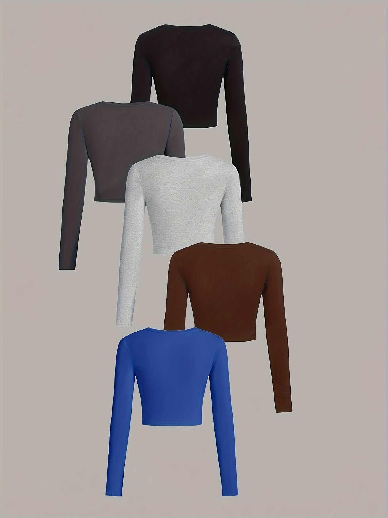 Five long-sleeve crop tops in different colors on a beige background