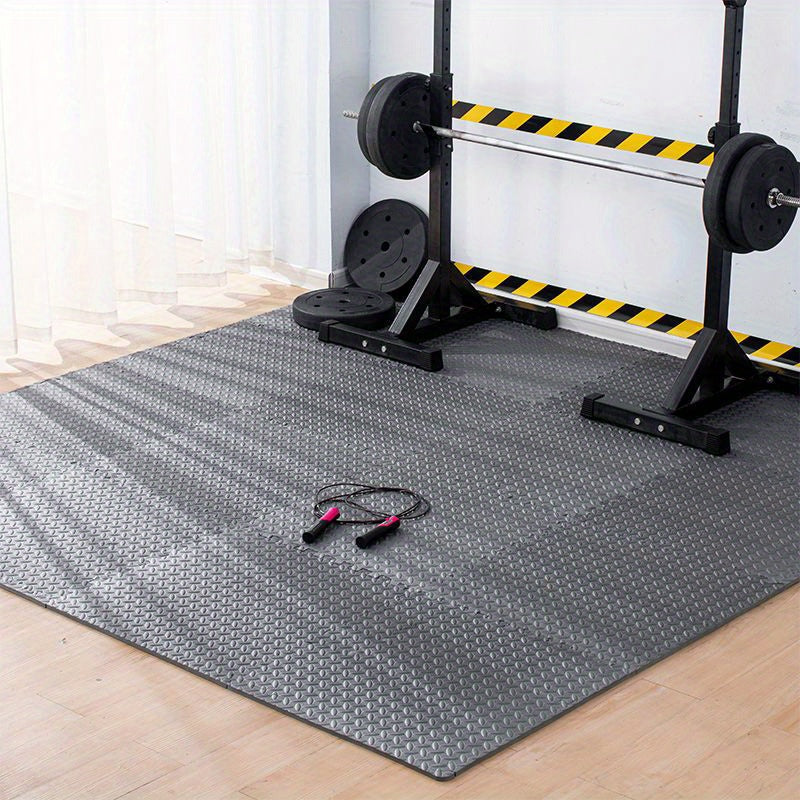 Gym mat with weightlifting equipment in the background