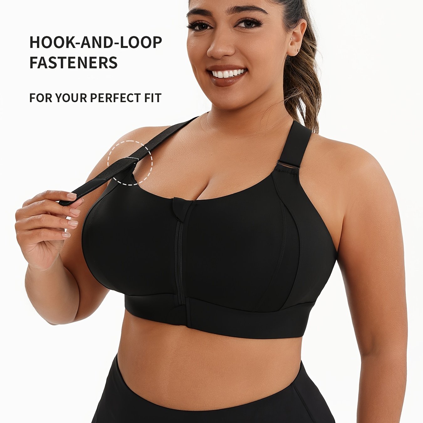 A woman wearing a black plus size sports bras with criss-cross back design sold by 100 Spartans