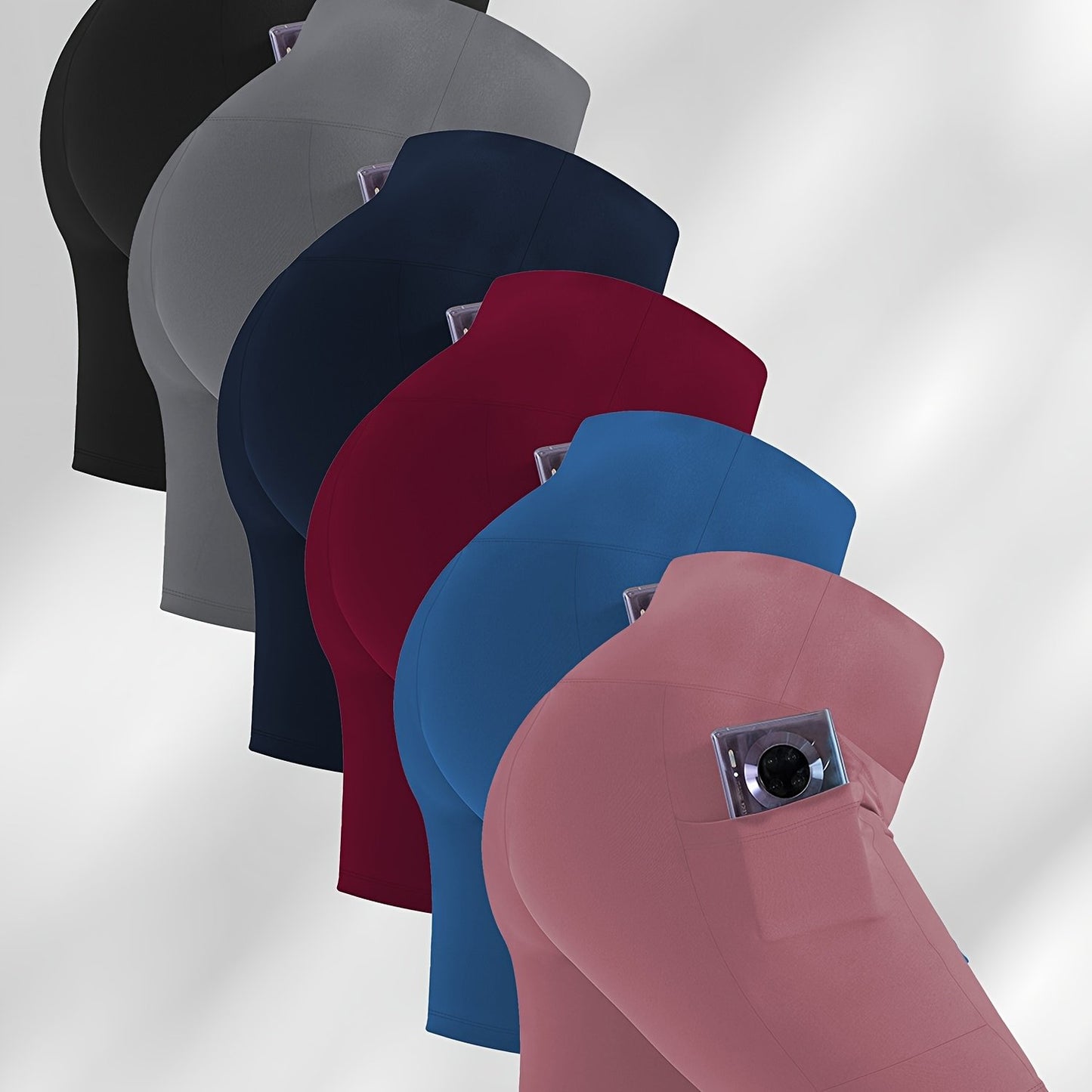 Set of women's workout shorts with pockets in various colors on a light gray background