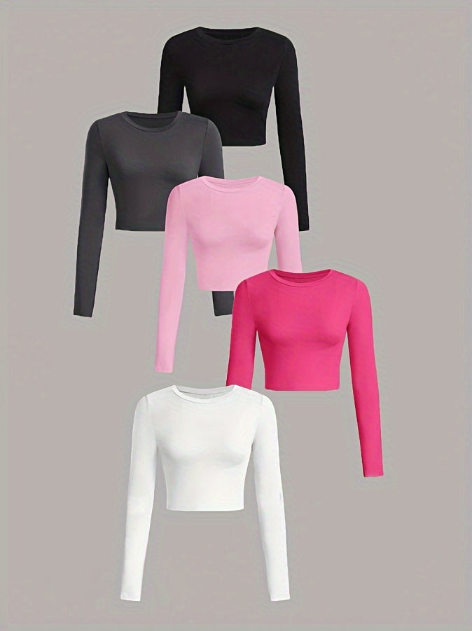 Five long-sleeve crop tops in black, gray, pink, and white on a gray background