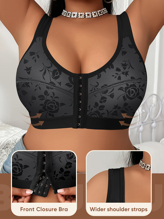 The front view of a woman wearing a black sports bras for big chests sold by 100 Spartans with front closure and wider shoulder straps.