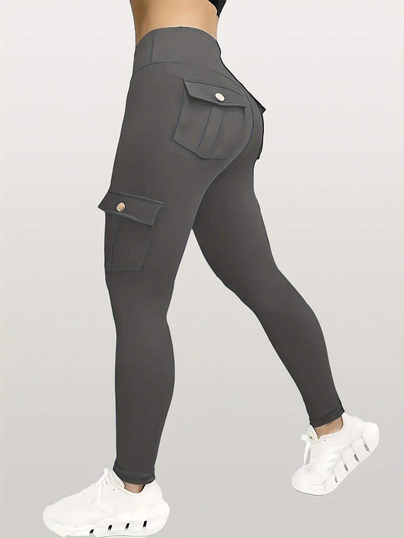 Gray yoga leggings with pockets on a gray background