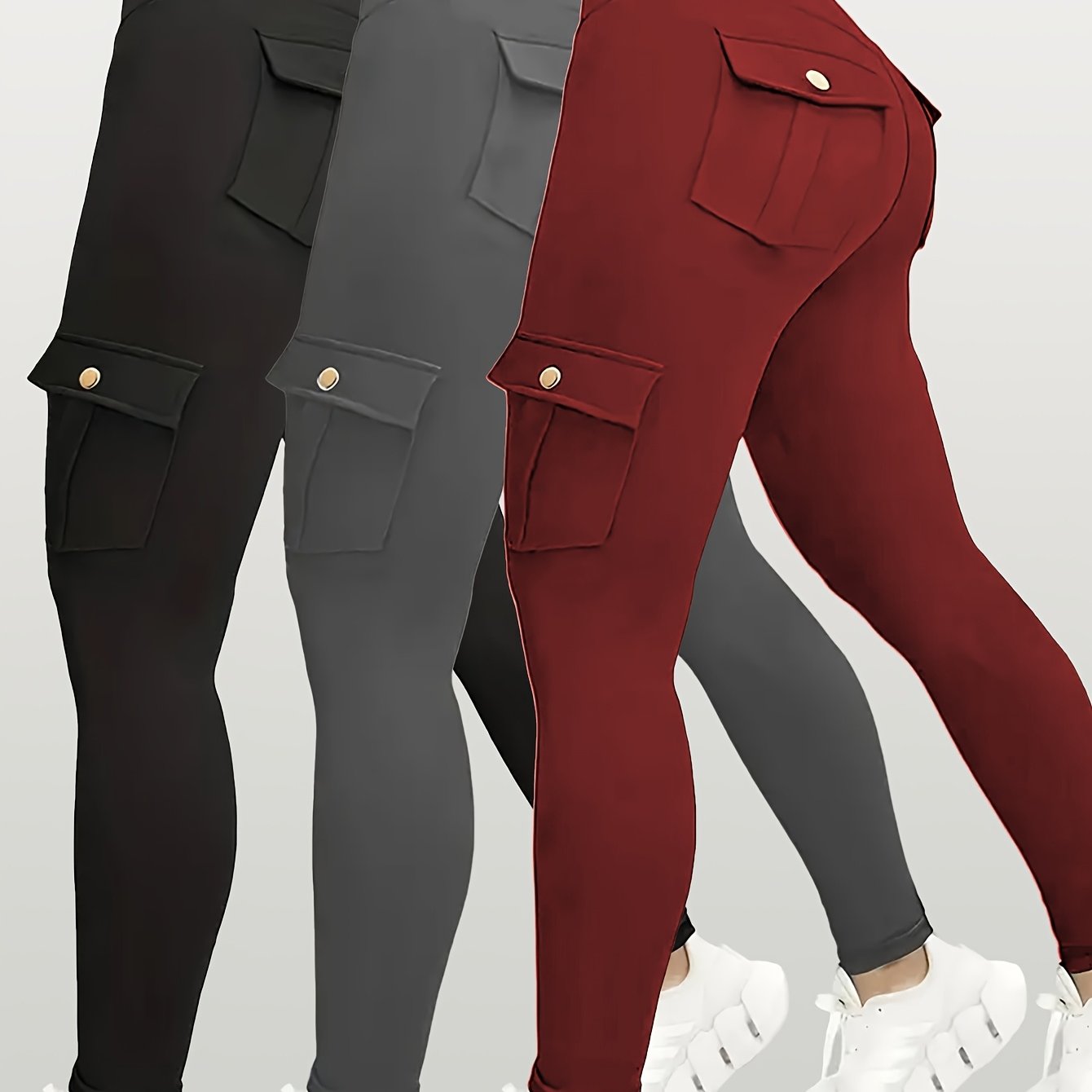 Black, gray, and red yoga leggings with pocket details on a light gray background