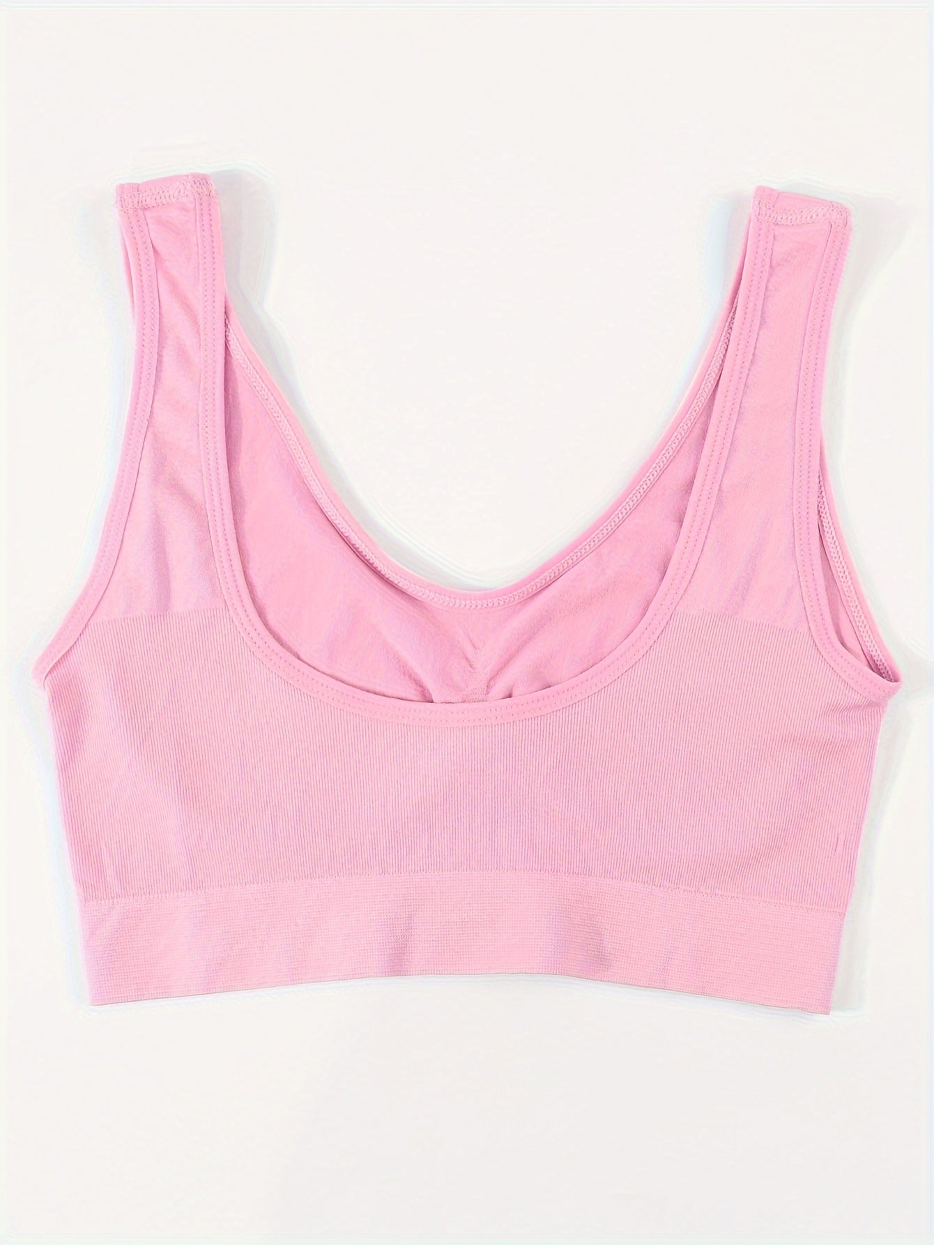 A back view of a pink Padded Sports Bra For Women sold by 100 Spartans on a white background