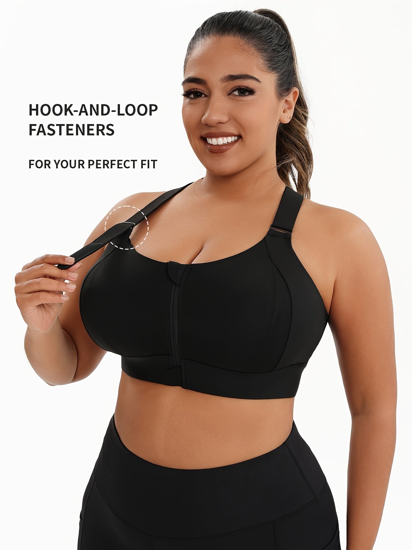 A woman wearing a black plus size sports bras with criss-cross back design sold by 100 Spartans