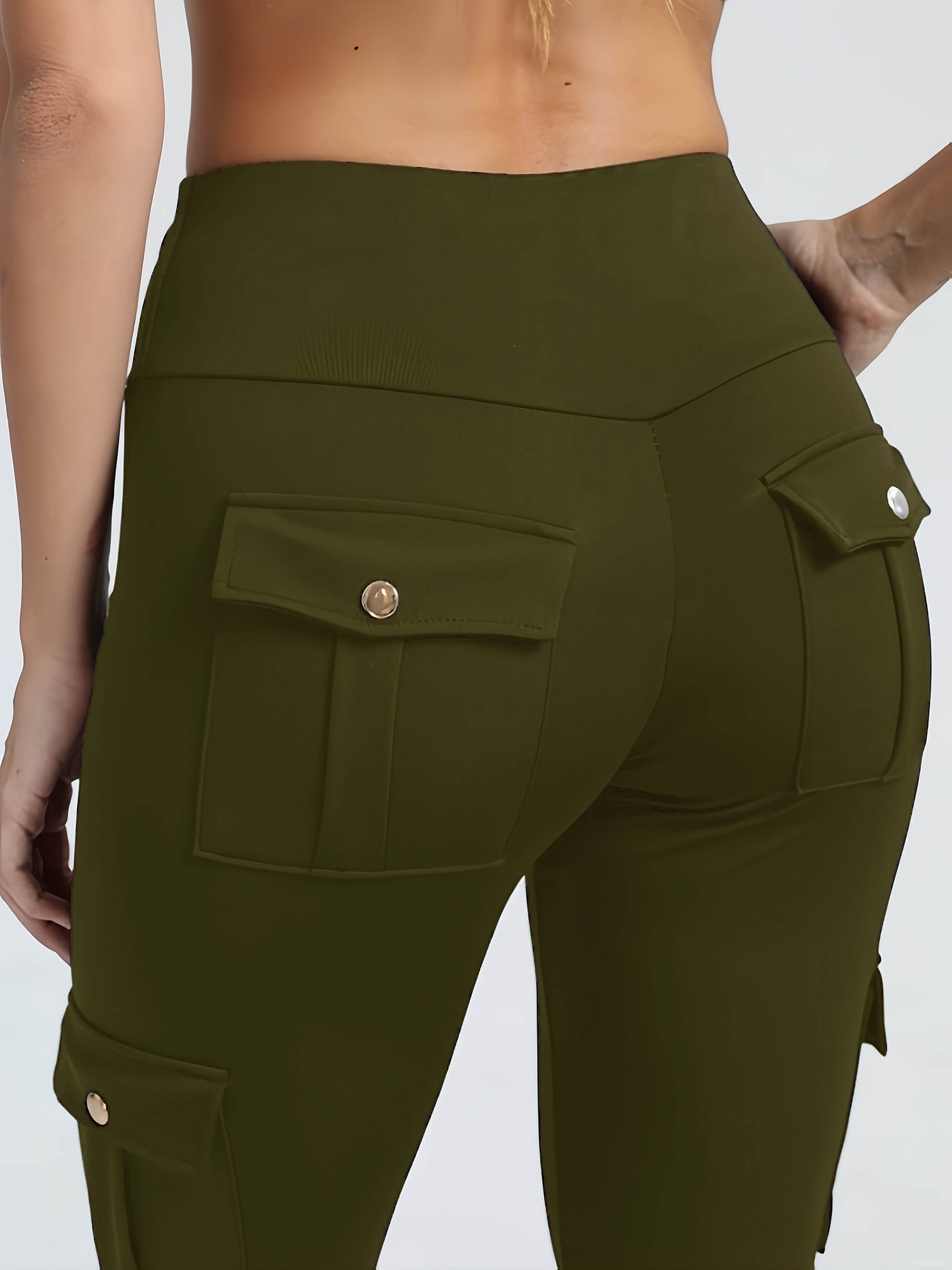 The back view of a woman wearing a pair of camouflage yoga legging sold by 100 Spartans