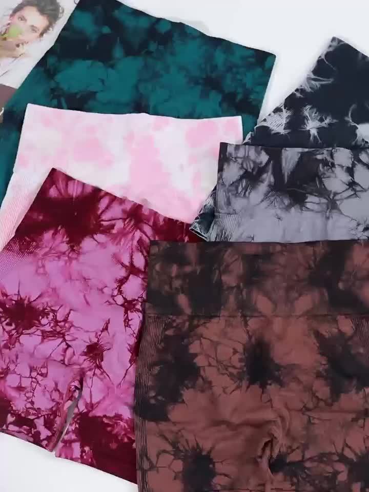 Collection of tie-dye fabric samples in various colors on a white background