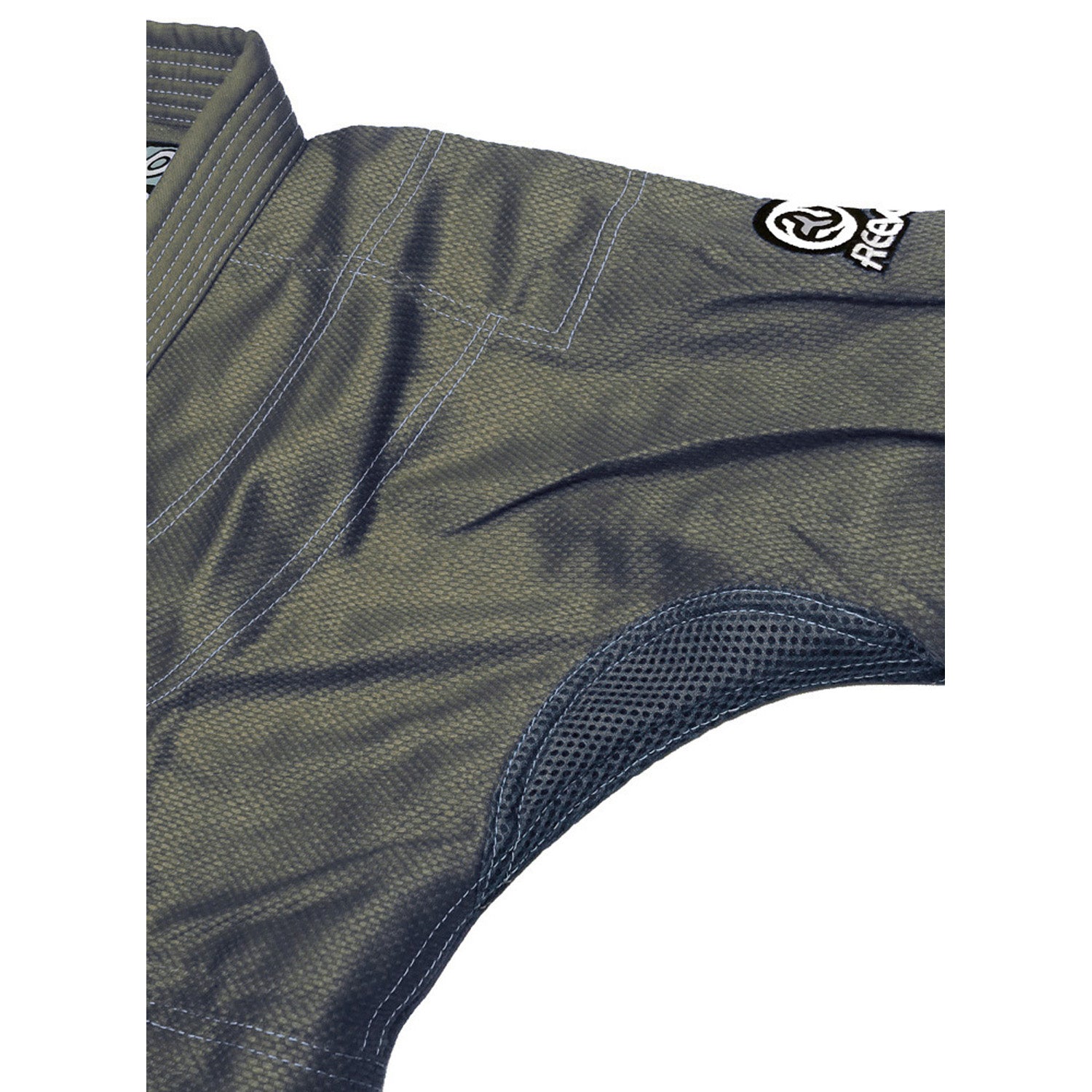 Close-up of a green athletic outfit with a brand logo on a white background