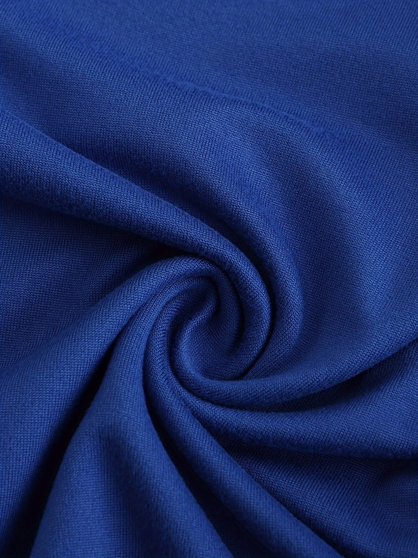 Close-up of blue fabric with a swirl pattern