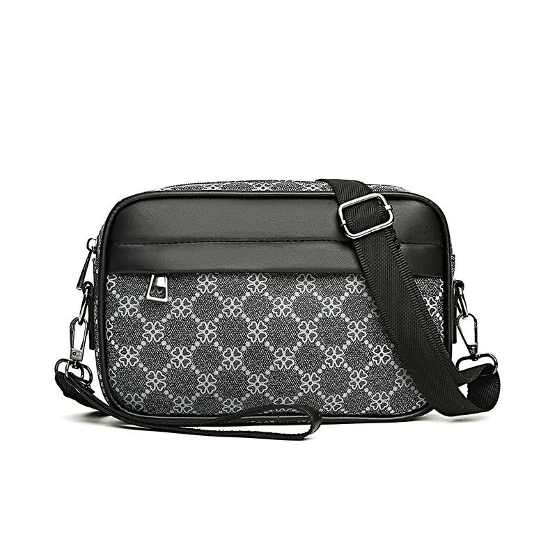 Black and gray patterned leather toiletry bag on a white background