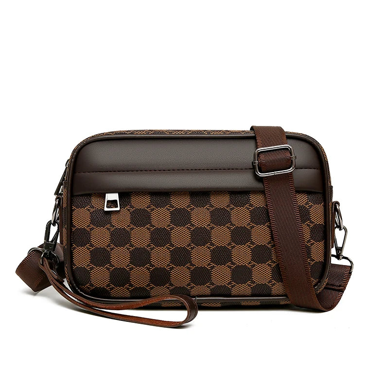 Brown checkered patterned leather toiletry bag with a strap on a white background