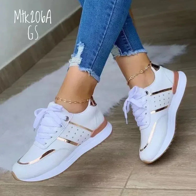 A white casual women sneakers sold by 100 Spartans