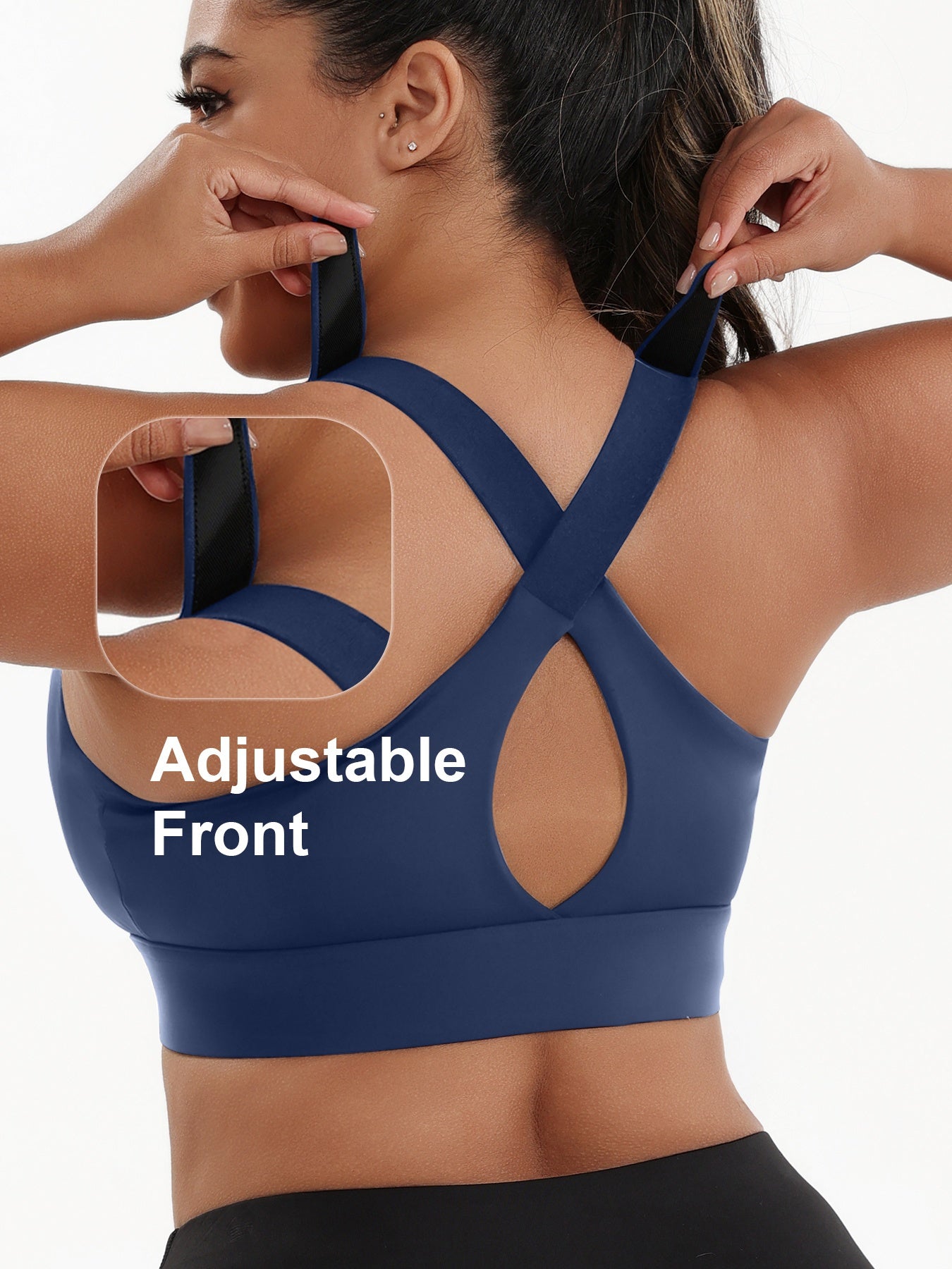 A woman wearing a blue plus size sports bras with criss-cross back design sold by 100 Spartans