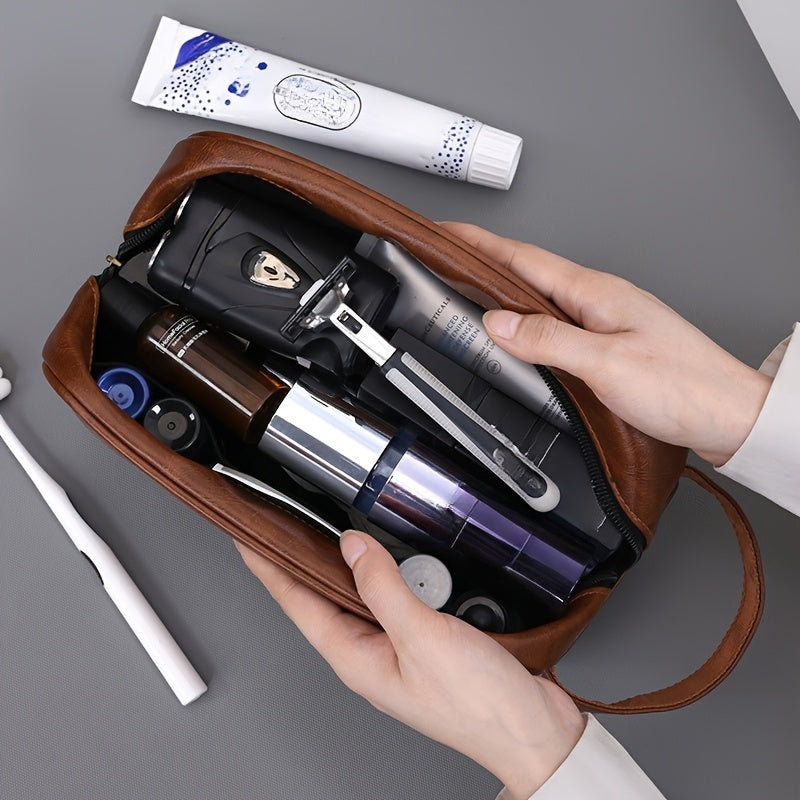 Brown toiletry bag with travel-sized products on a gray background