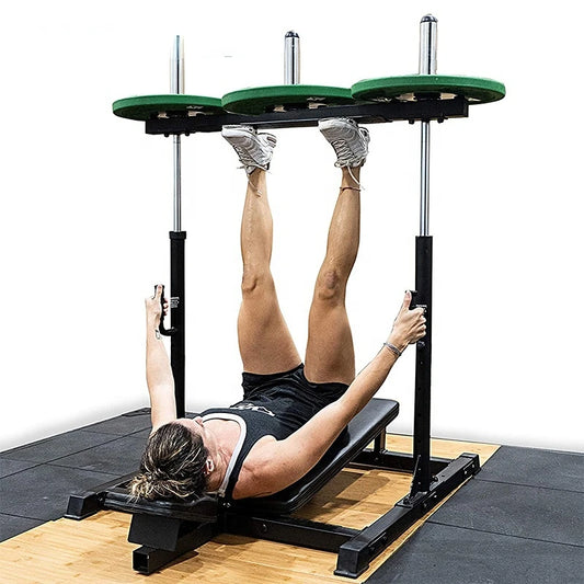 A woman working out with a vertical leg press machine sold by 100 Spartans