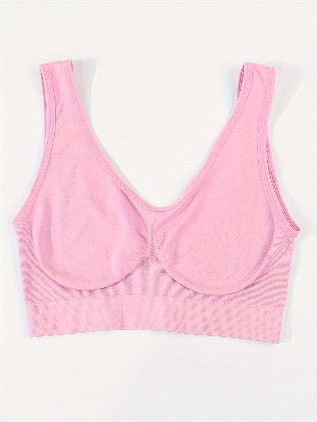 A pink Padded Sports Bra For Women sold by 100 Spartans on a white background