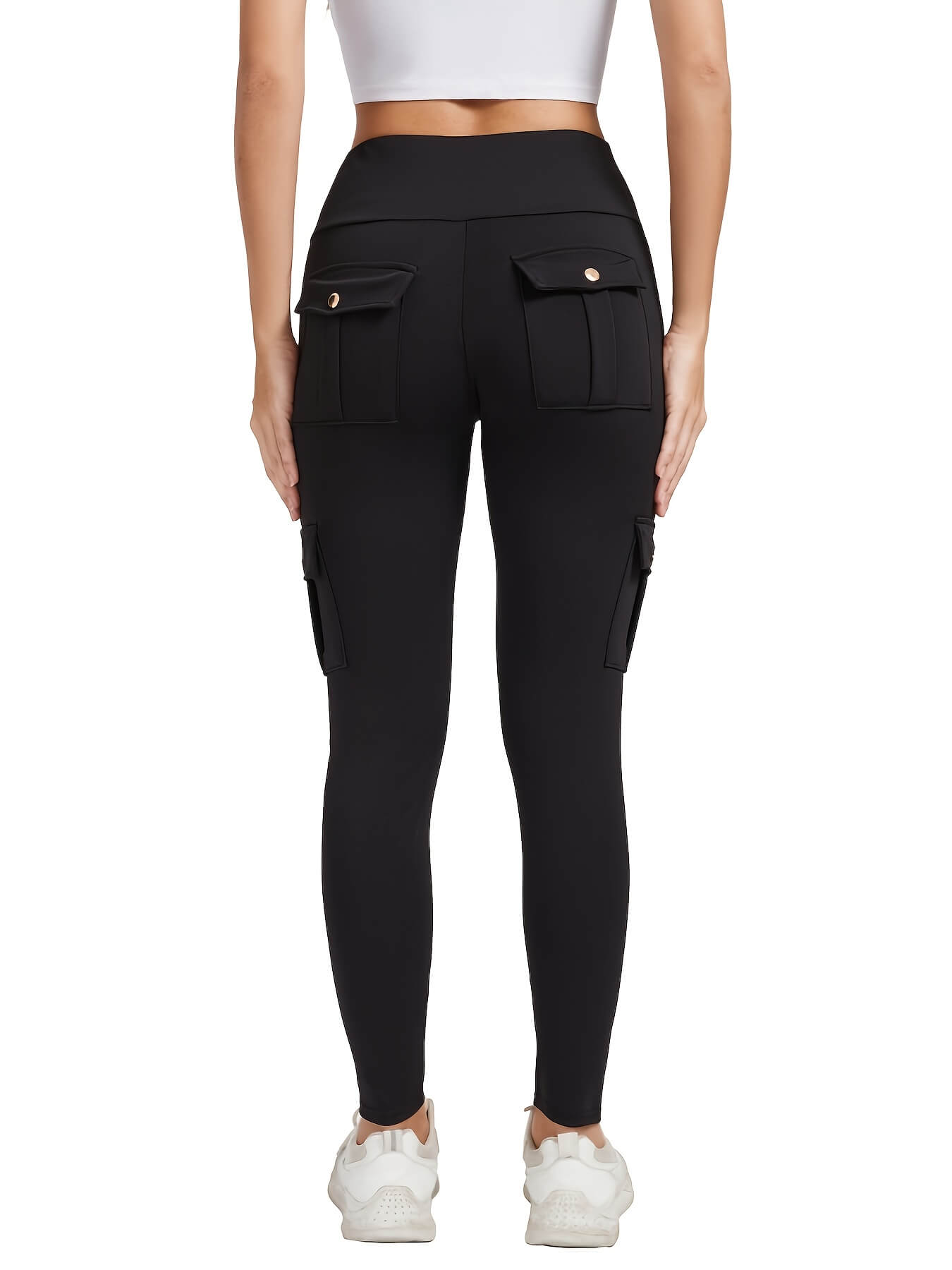 The back view of a woman wearing a pair of black yoga legging sold by 100 Spartans