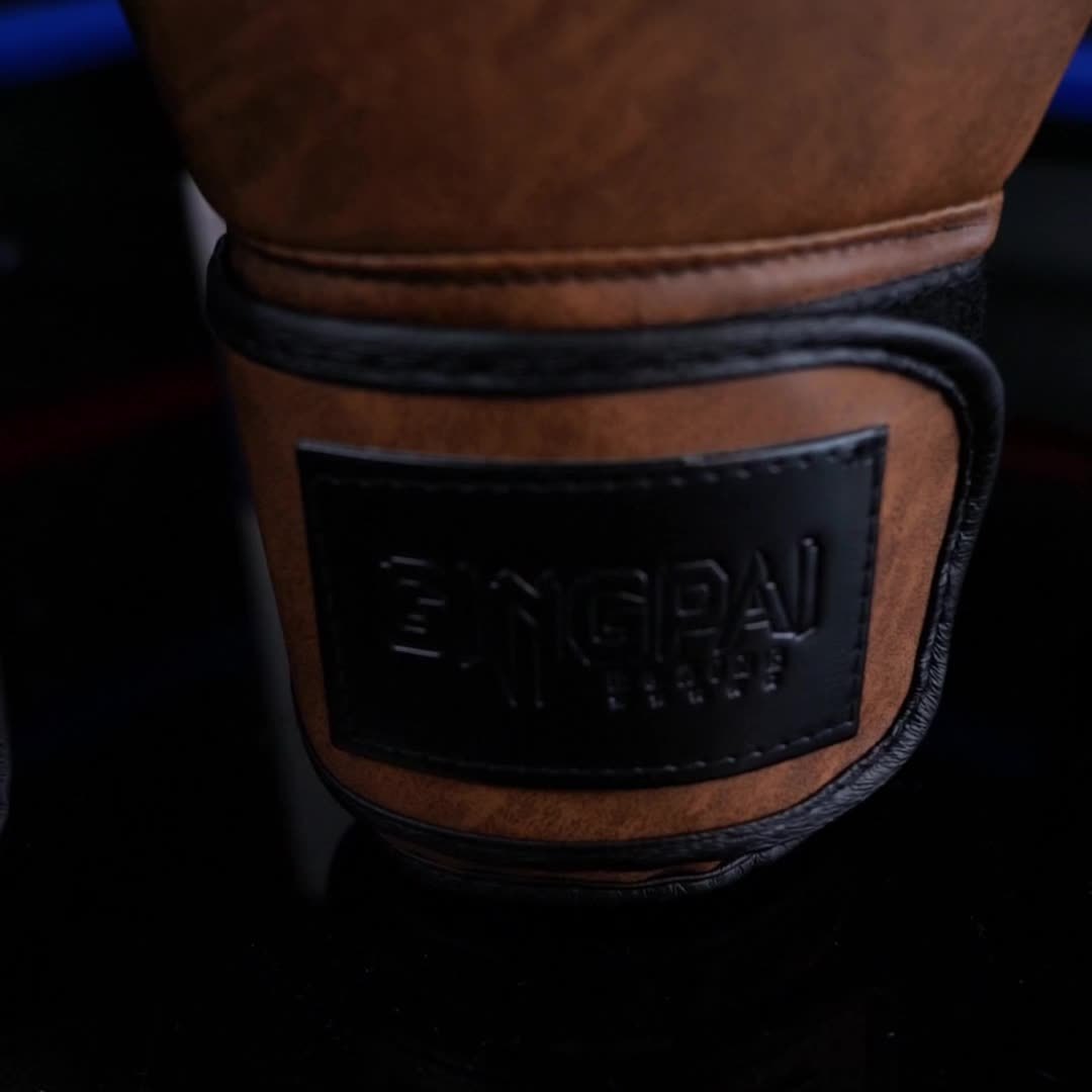 The cuff of a brown vintage series unified boxing gloves sold by 100 Spartans