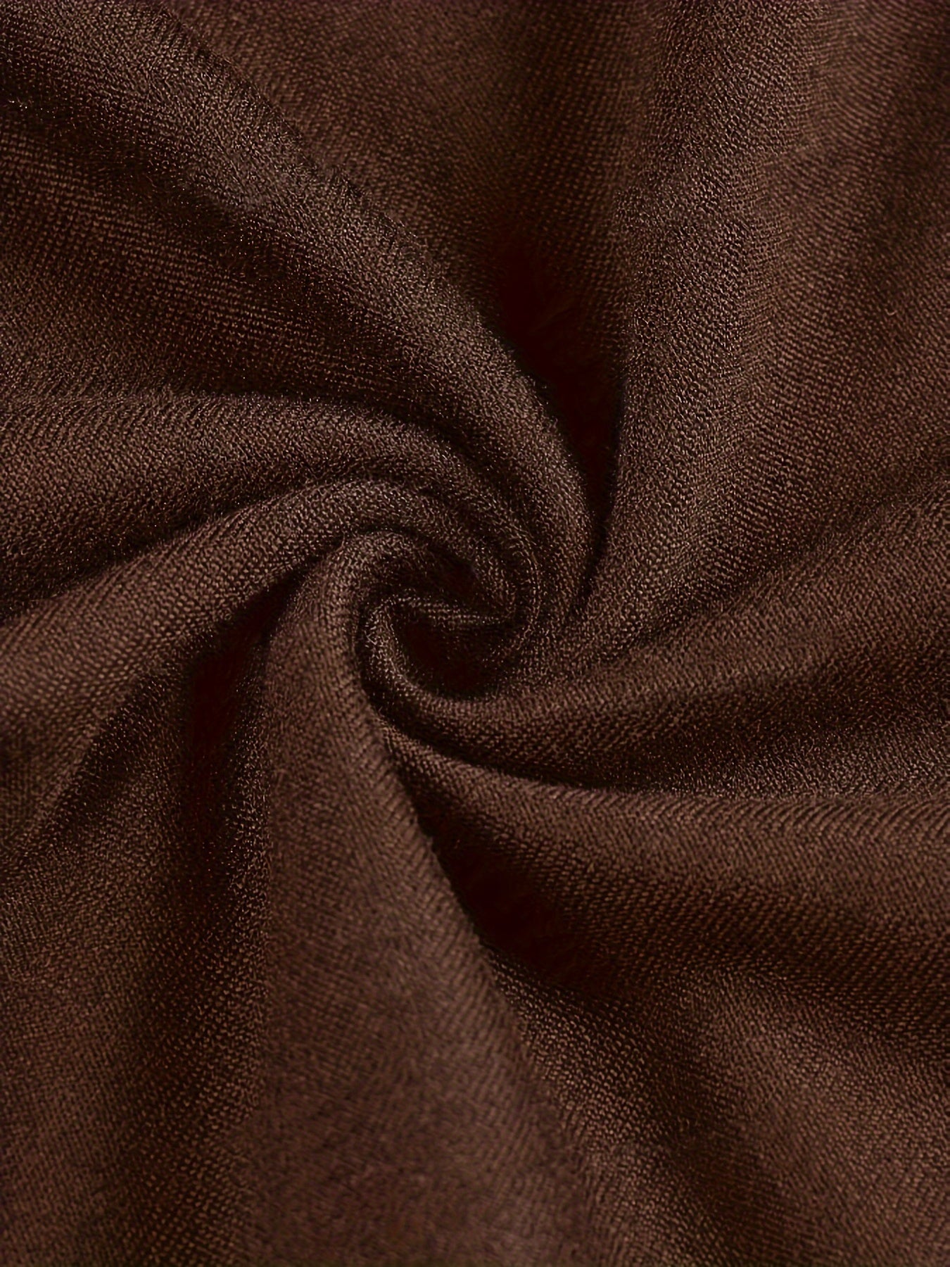 Close-up of brown fabric with a textured pattern