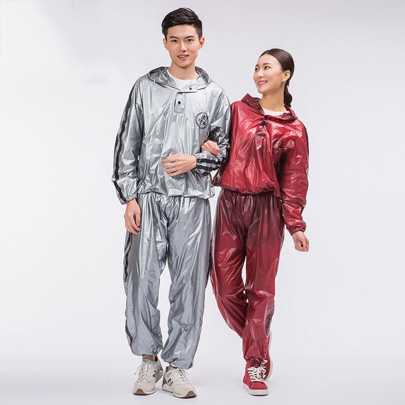 Two people wearing silver and red rain suits on a white background