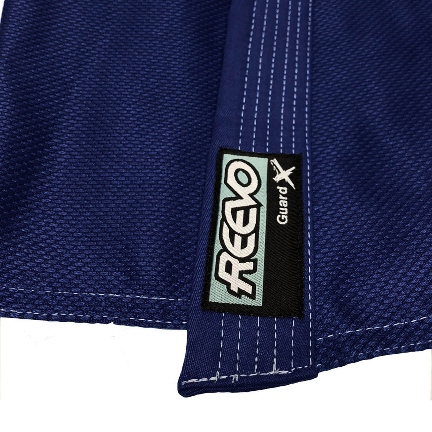 Close-up of a blue fabric with a REEVO Guard logo tag.