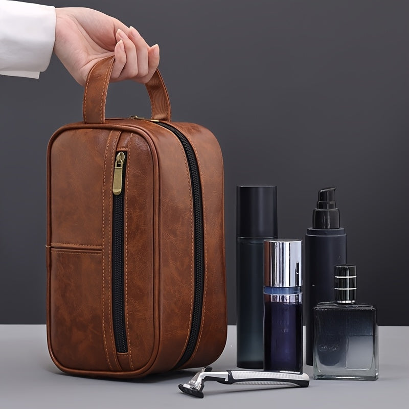 Brown leather toiletry bag with grooming products on a gray background