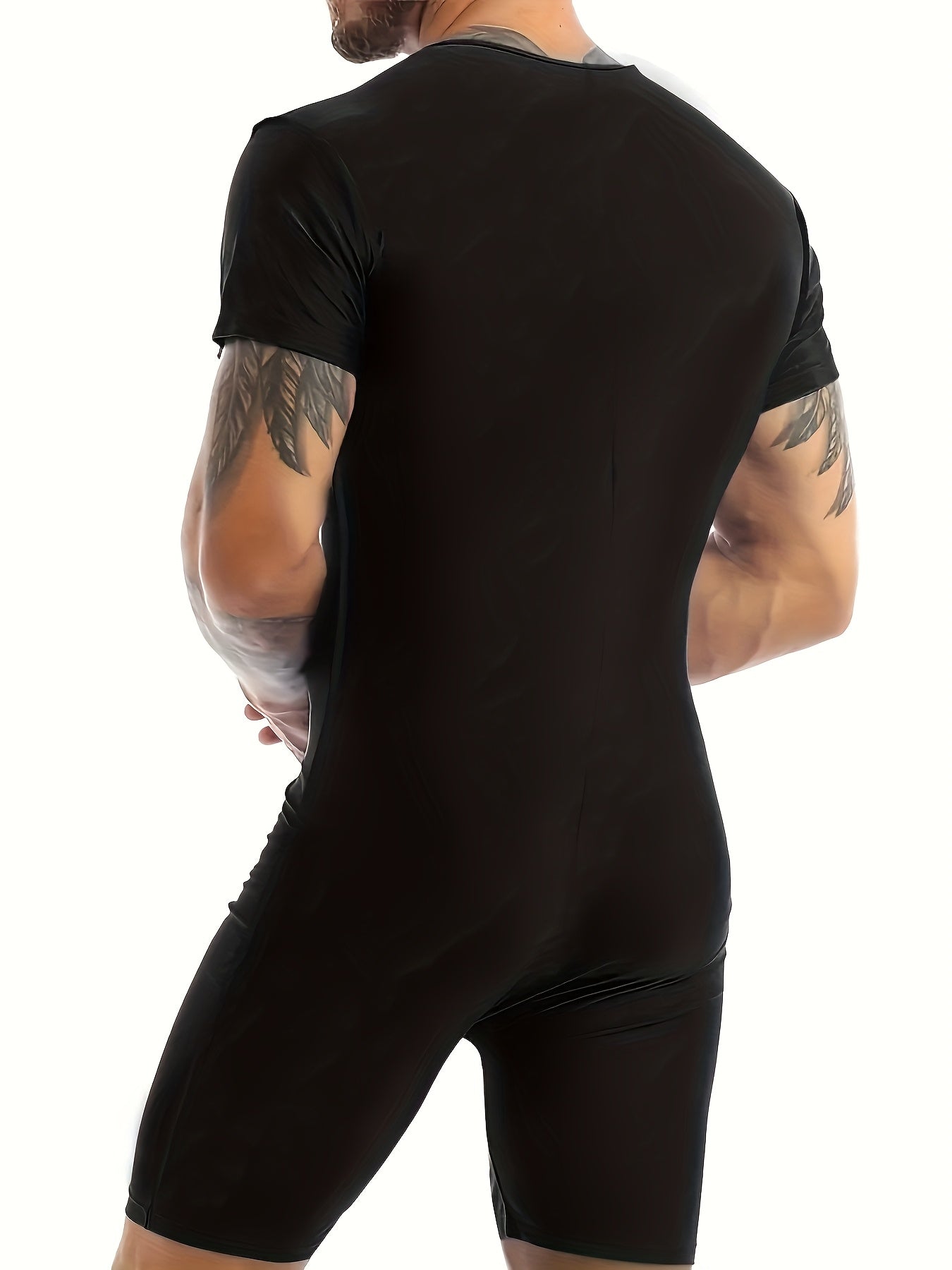 Person wearing a black athletic outfit on a white background