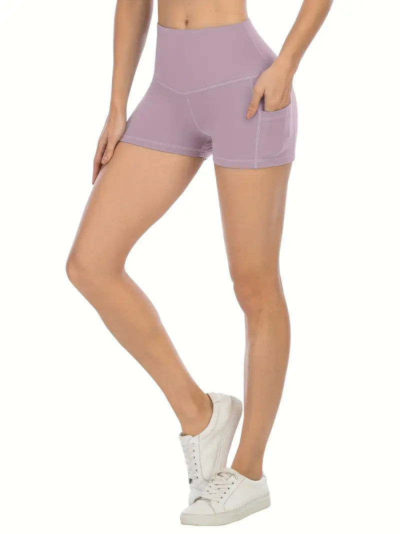 Person wearing lavender biker shorts with pockets on a white background