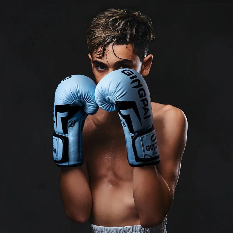 A boy training with the light blue PU boxing gloves sold by 100 Spartans