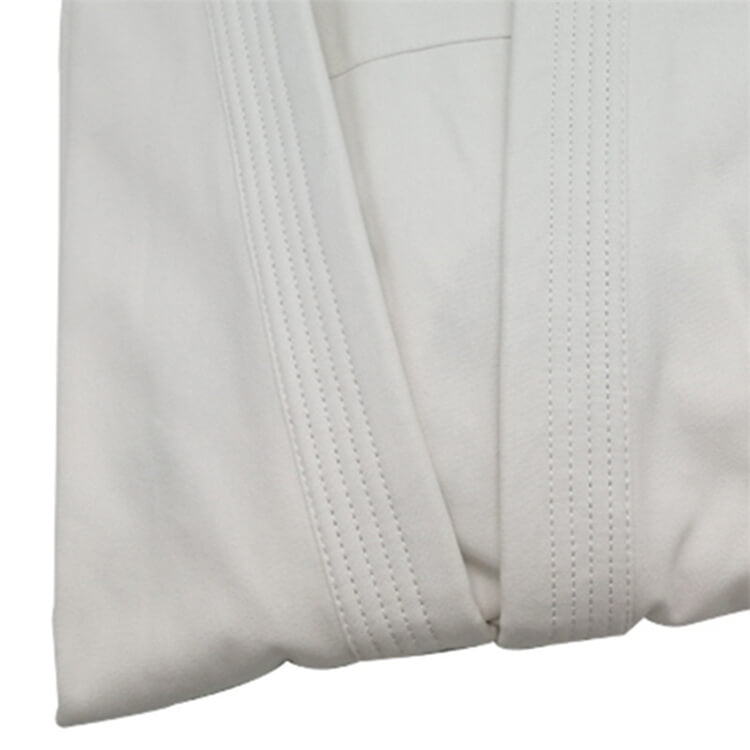 A folded 12oz Kyokushin Karate Uniform sold by 100 Spartans