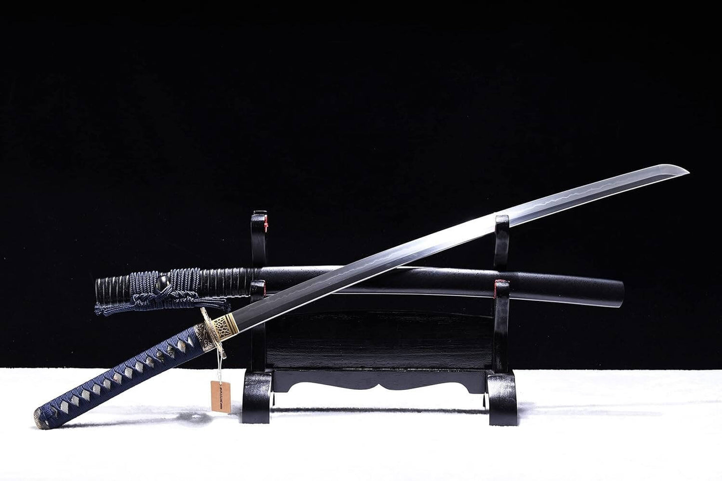 Training sword on a stand with a black background