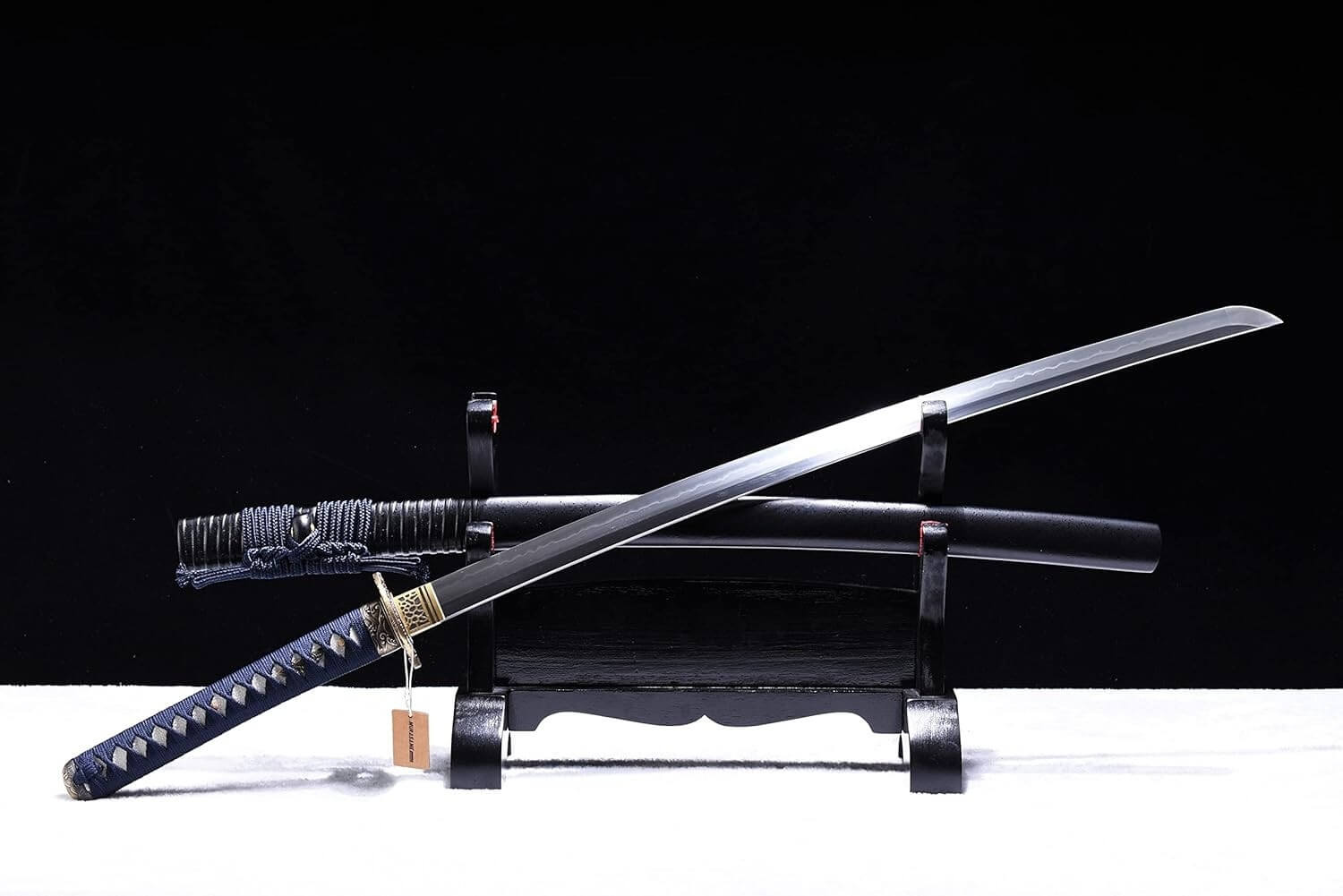 Training sword on a stand with a black background