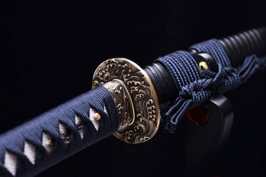 Training sword with blue sheath and gold decorative buckle on a black background