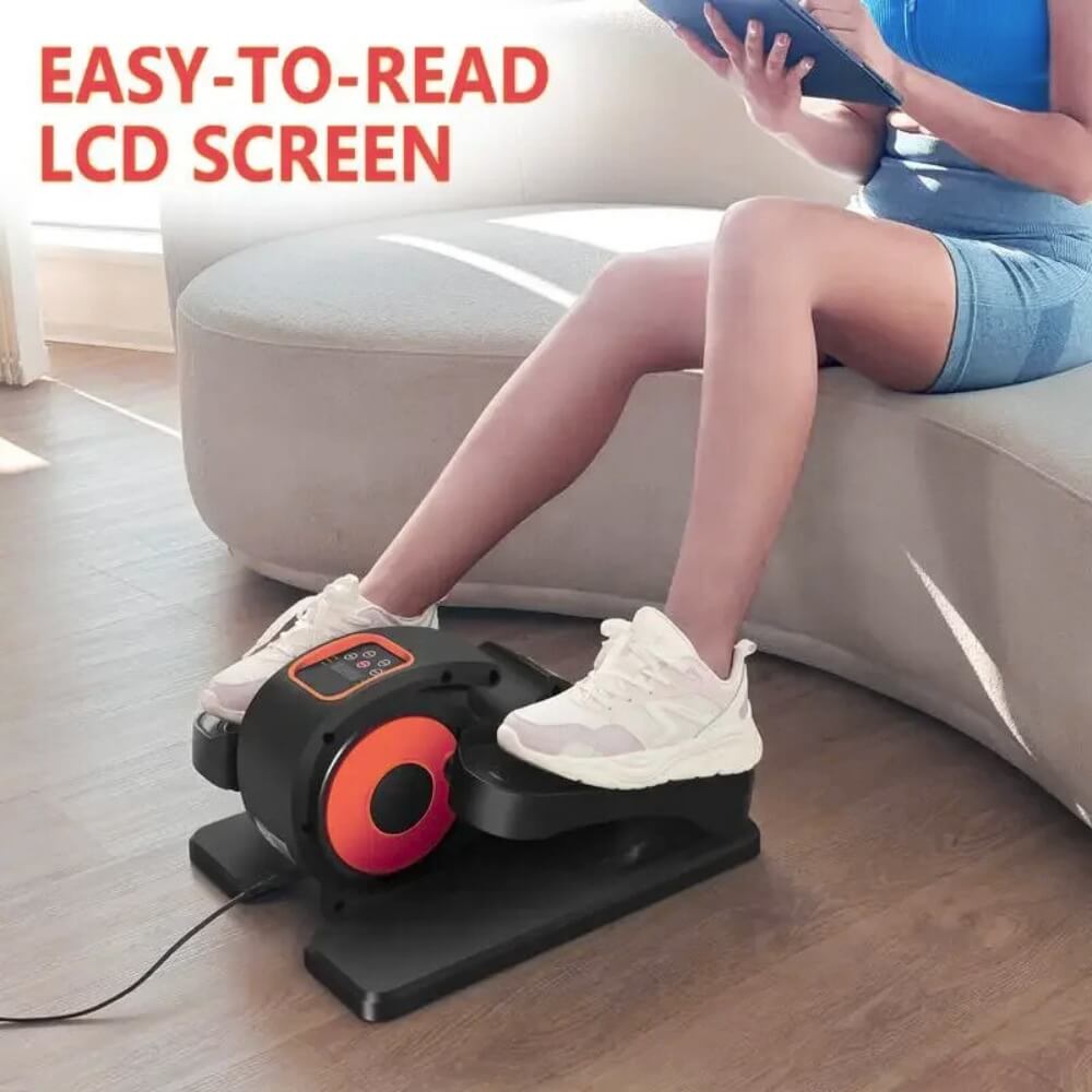 A woman working out on an under the desk elliptical machine sold by 100 Spartans