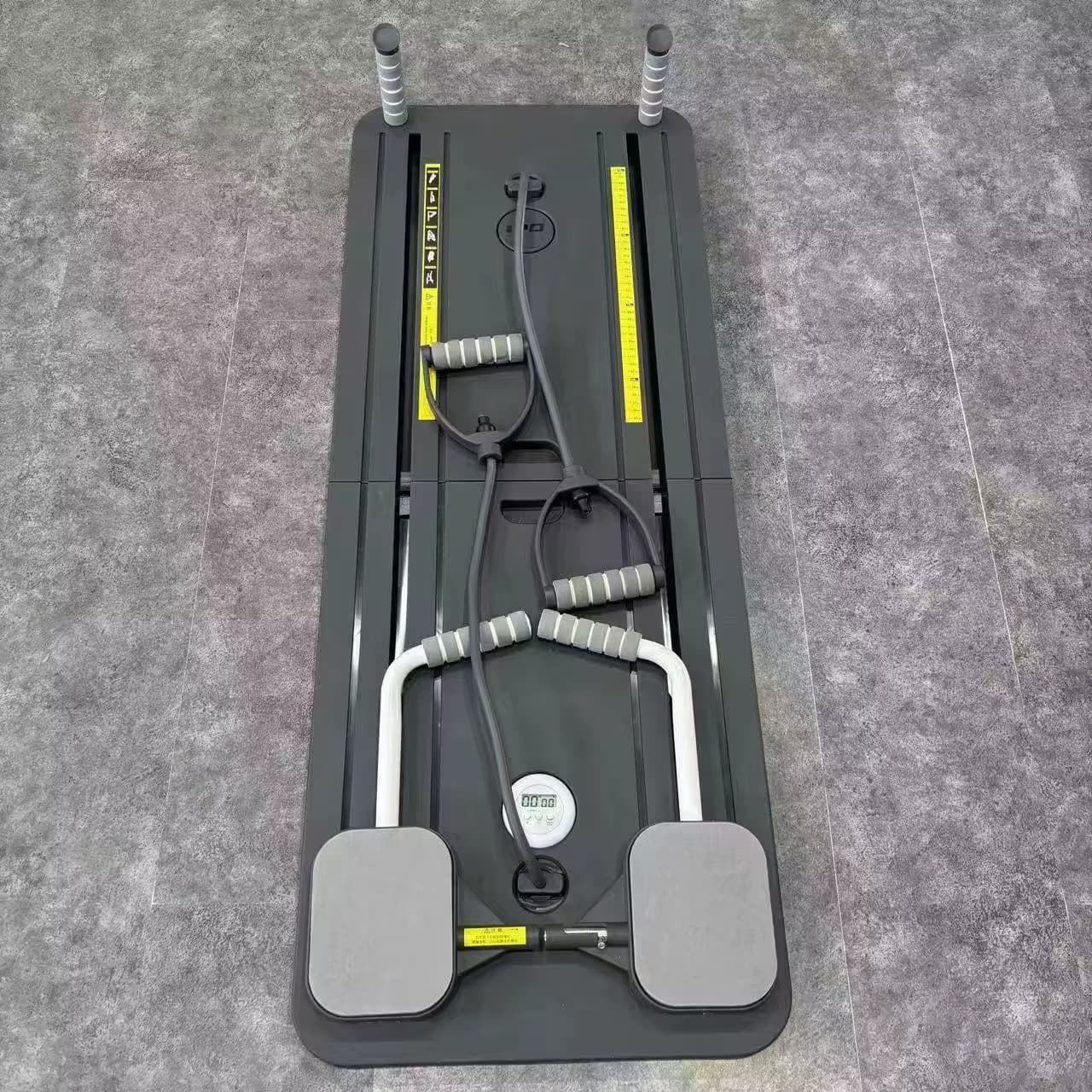 A black Pilates Board with accessories sold by 100 Spartans