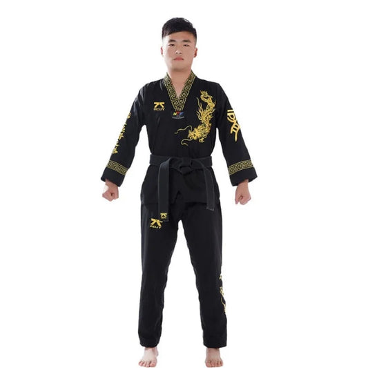 Person wearing a black martial arts uniform with gold designs on a white background