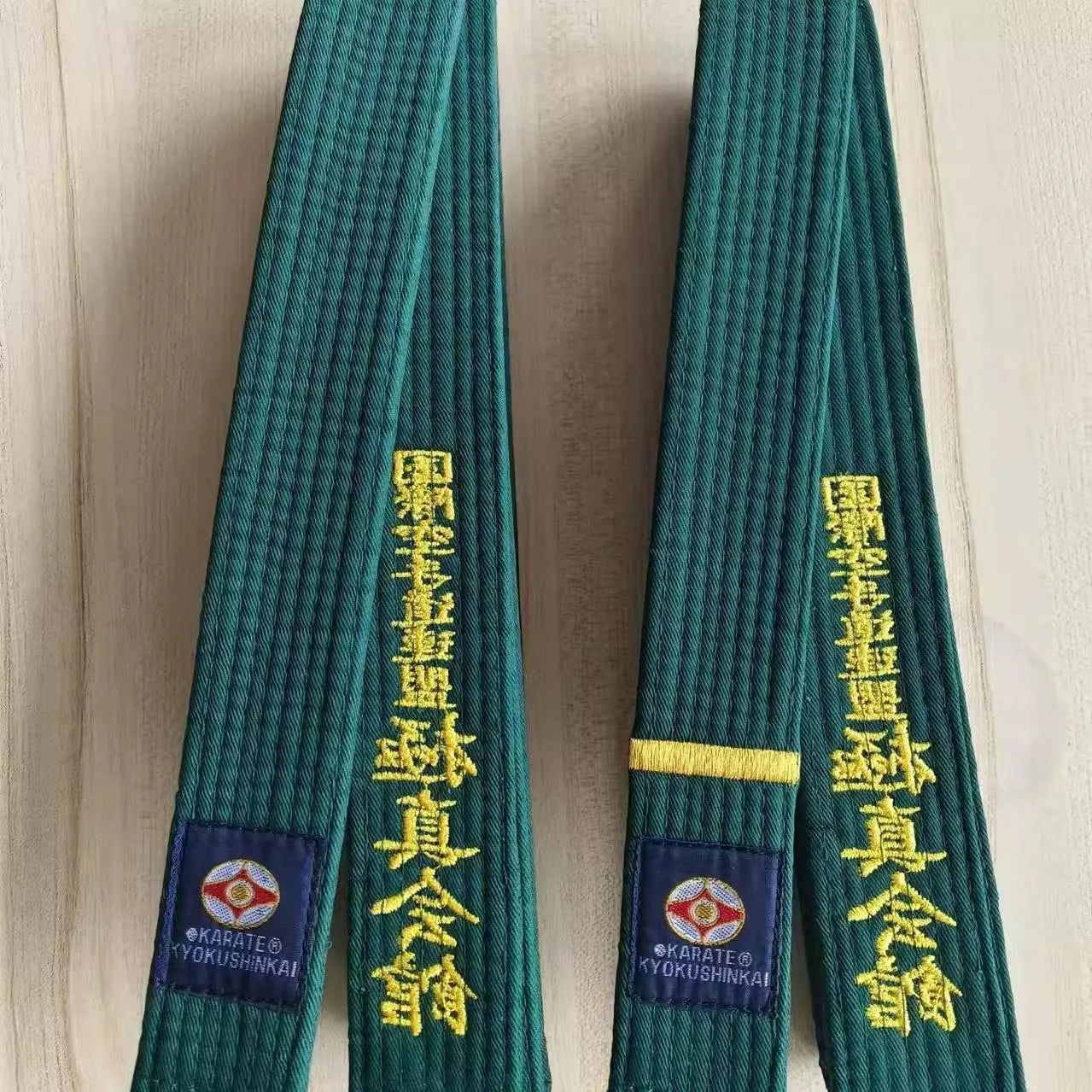 Green belts in karate sold by 100 Spartans