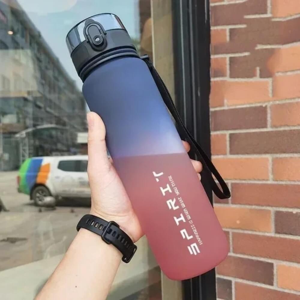 A purple and red sport water bottle sold by 100 Spartans