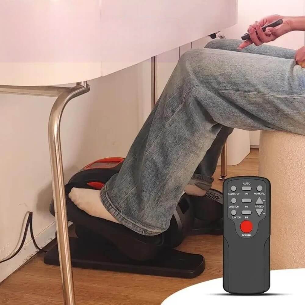 A person working out with an under the desk elliptical machine sold by 100 Spartans