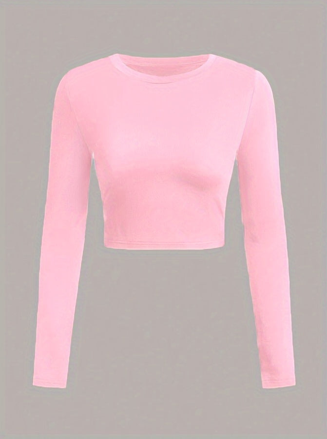 Pink long-sleeve crop top on a gray background