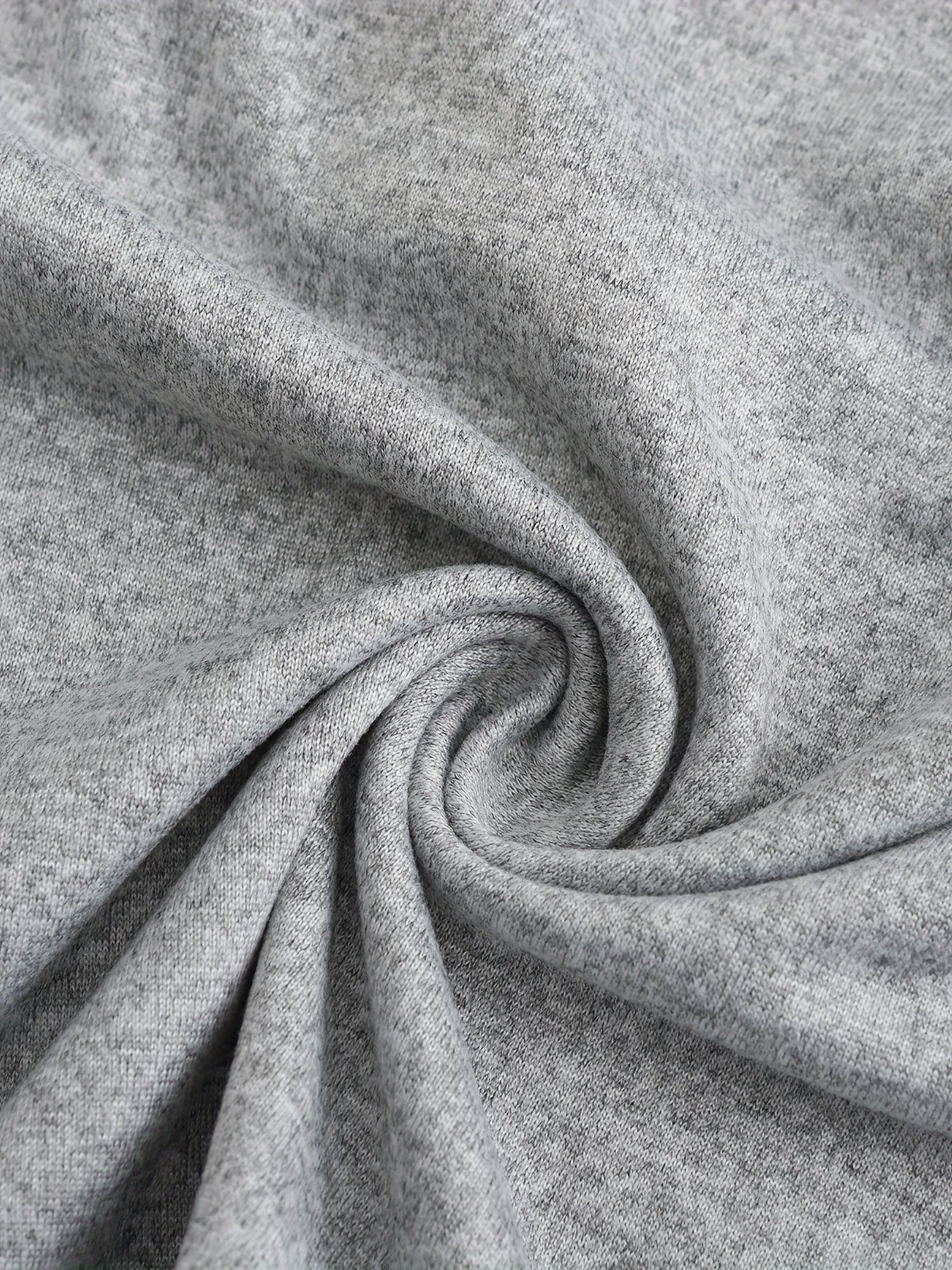 Close-up of gray fabric with a swirl pattern