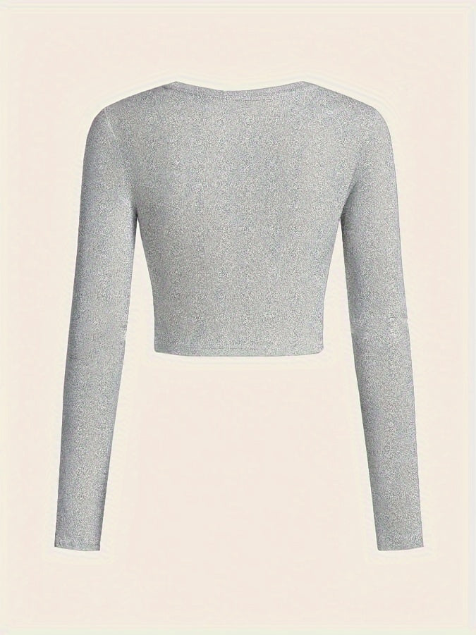 Gray long-sleeve crop top on a beige background