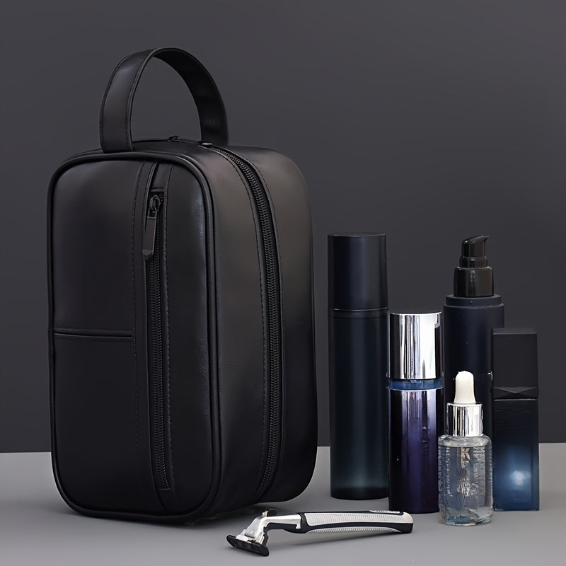 Black toiletry bag with grooming products on a gray background