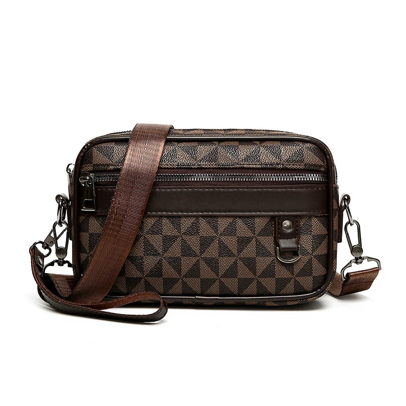 Brown patterned leather toiletry bag with a strap on a white background